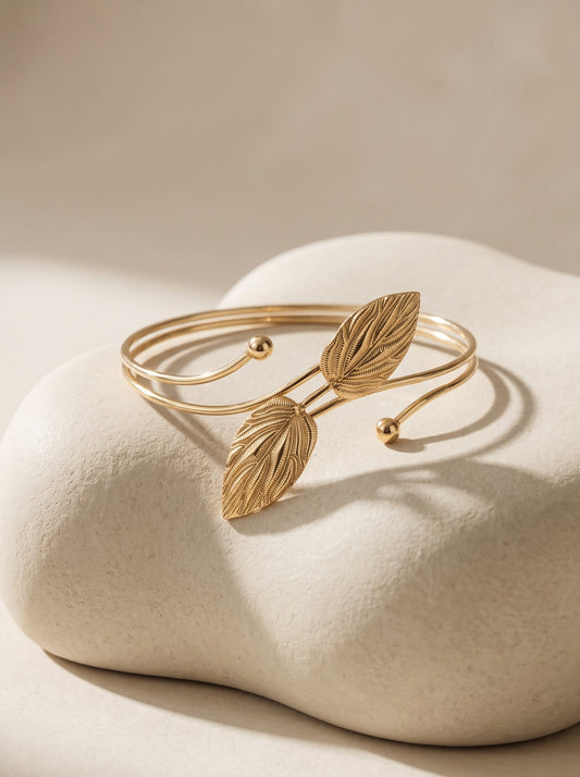Gold-plated leaf wrap bangle by DERAC