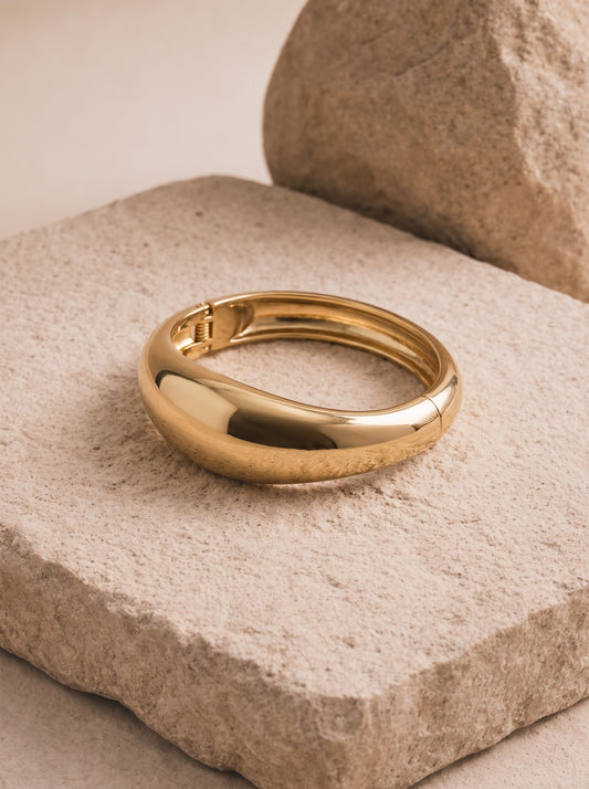 Domed gold-plated bangle by DERAC